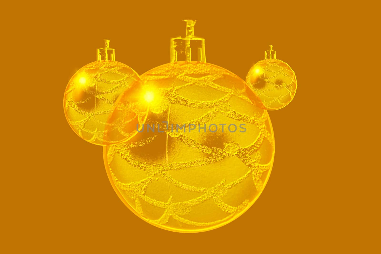 Abstract design concept of three gold ornaments.