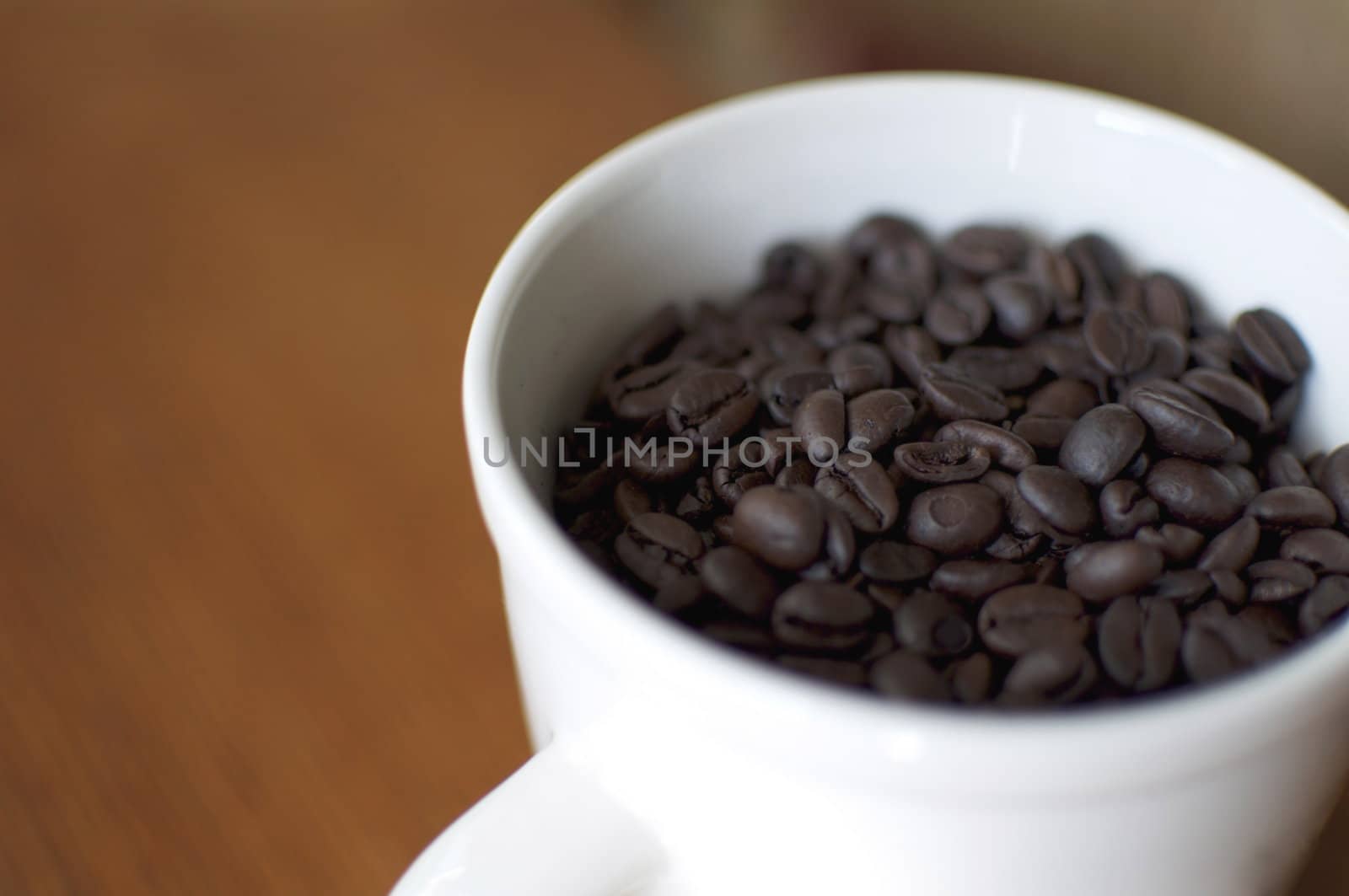 Coffee Beans in a White Porcelain Mug by gilmourbto2001