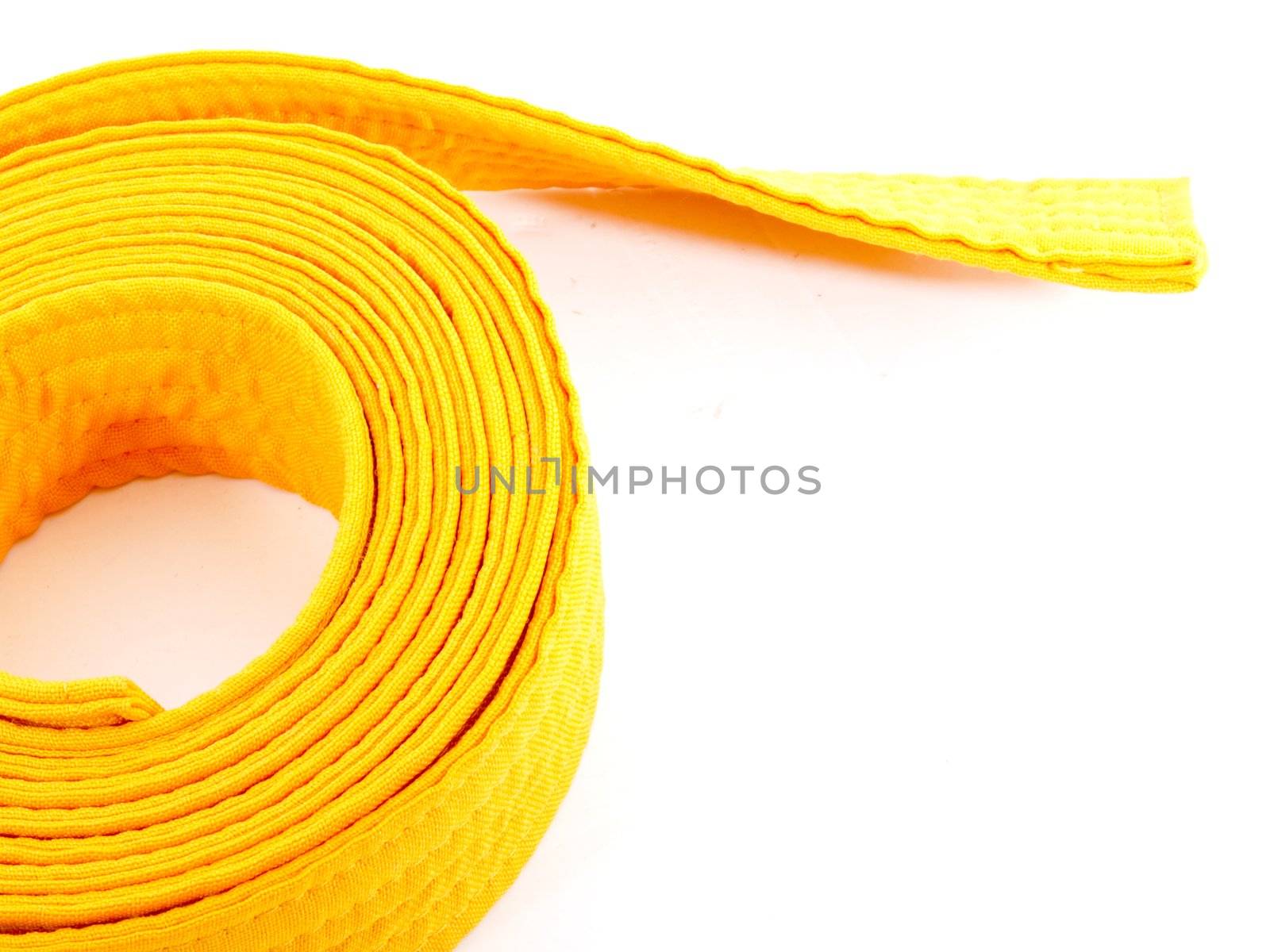 Yellow Cloth belt rolled on white background