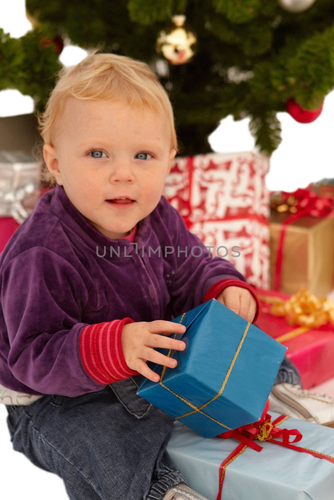 Christmas - child opening x-mas presents
