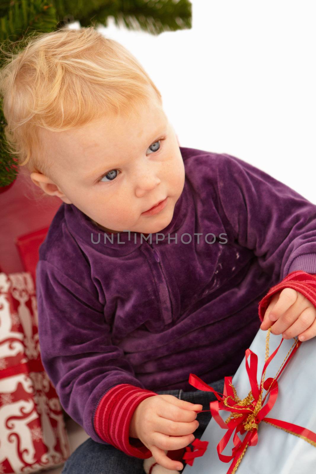Christmas - Cute child opening presents on x-mas day
