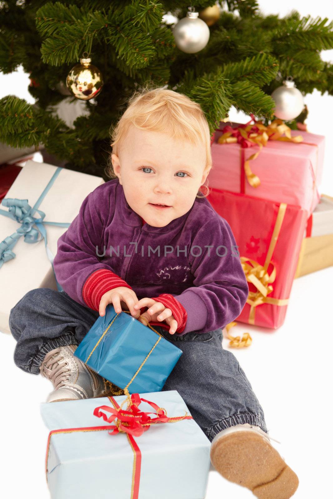 Christmas - Cute child opening gifts on x-mas day