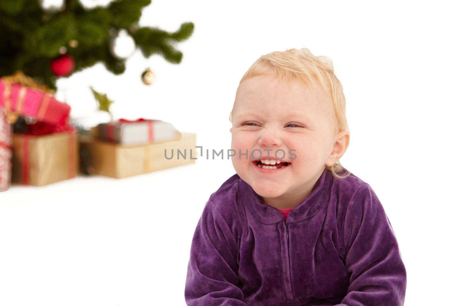 Christmas - Cute little girl smiling on white  by FreedomImage