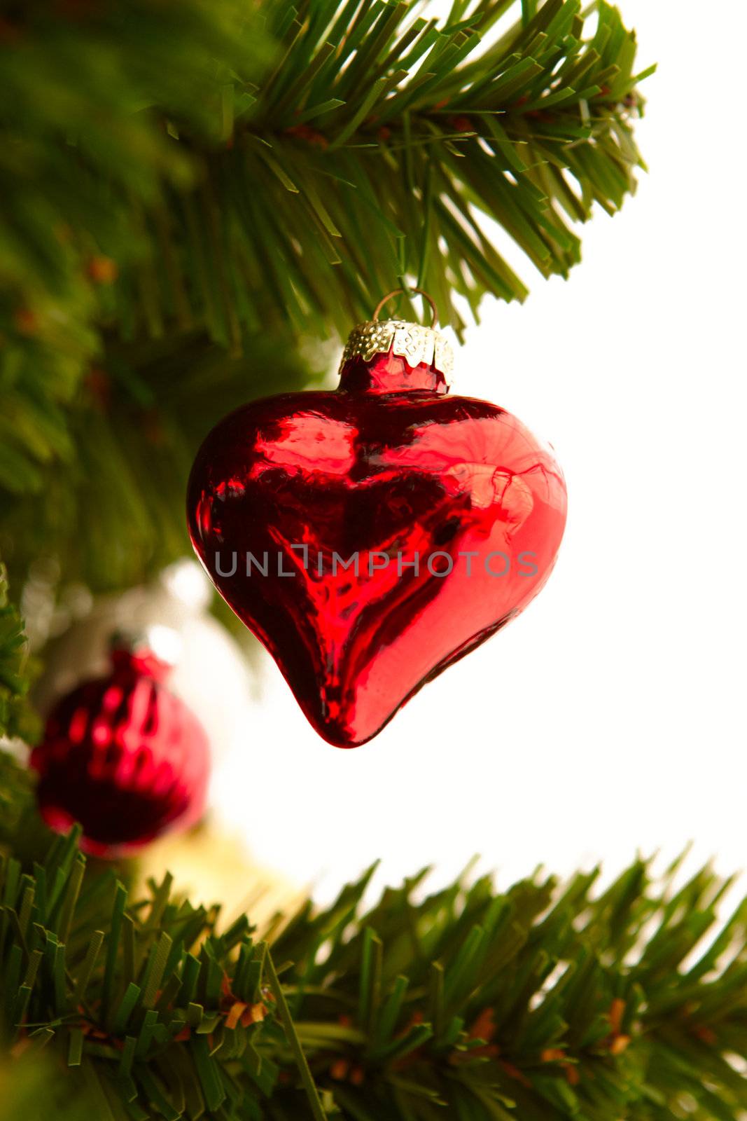 Christmas - Red heart decoration on white by FreedomImage