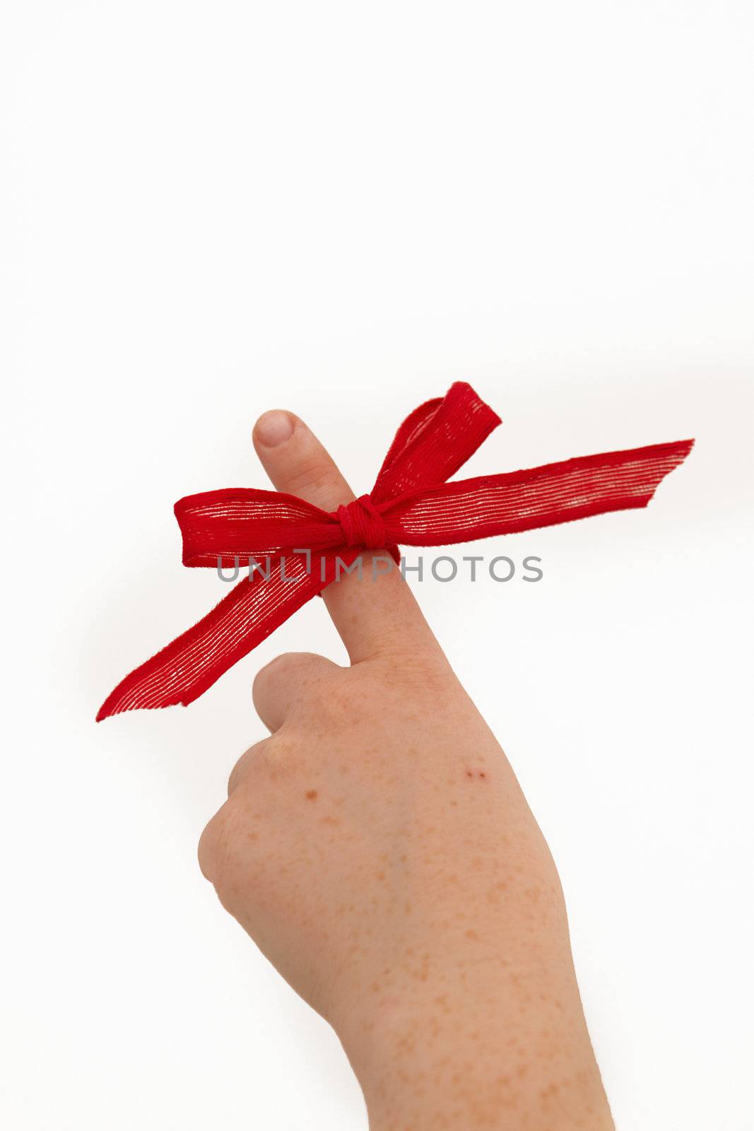 Womans hand with red ribbon pointing upwards