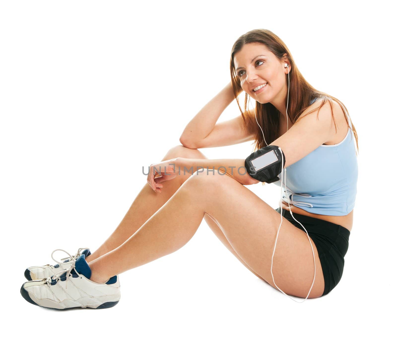 Portrait of smiling fitness women with mp3 player. Isolated on white