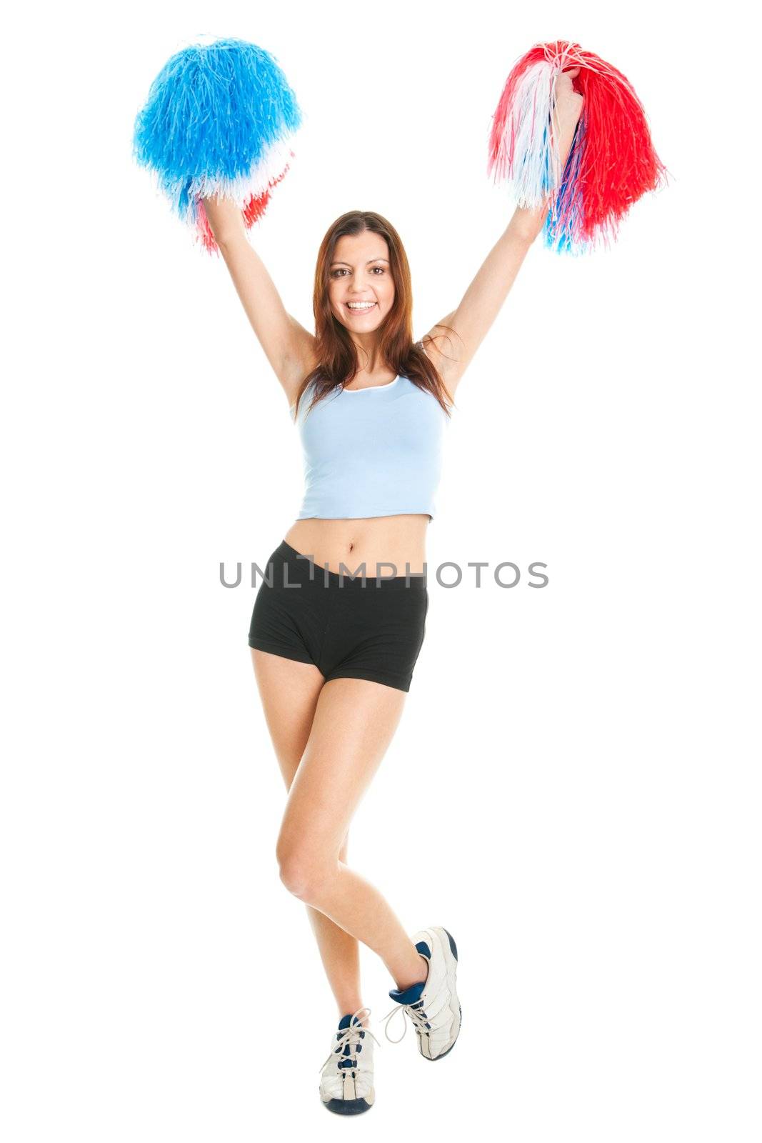 Smiling cheerleader girl posing with pom poms. Isolated on white