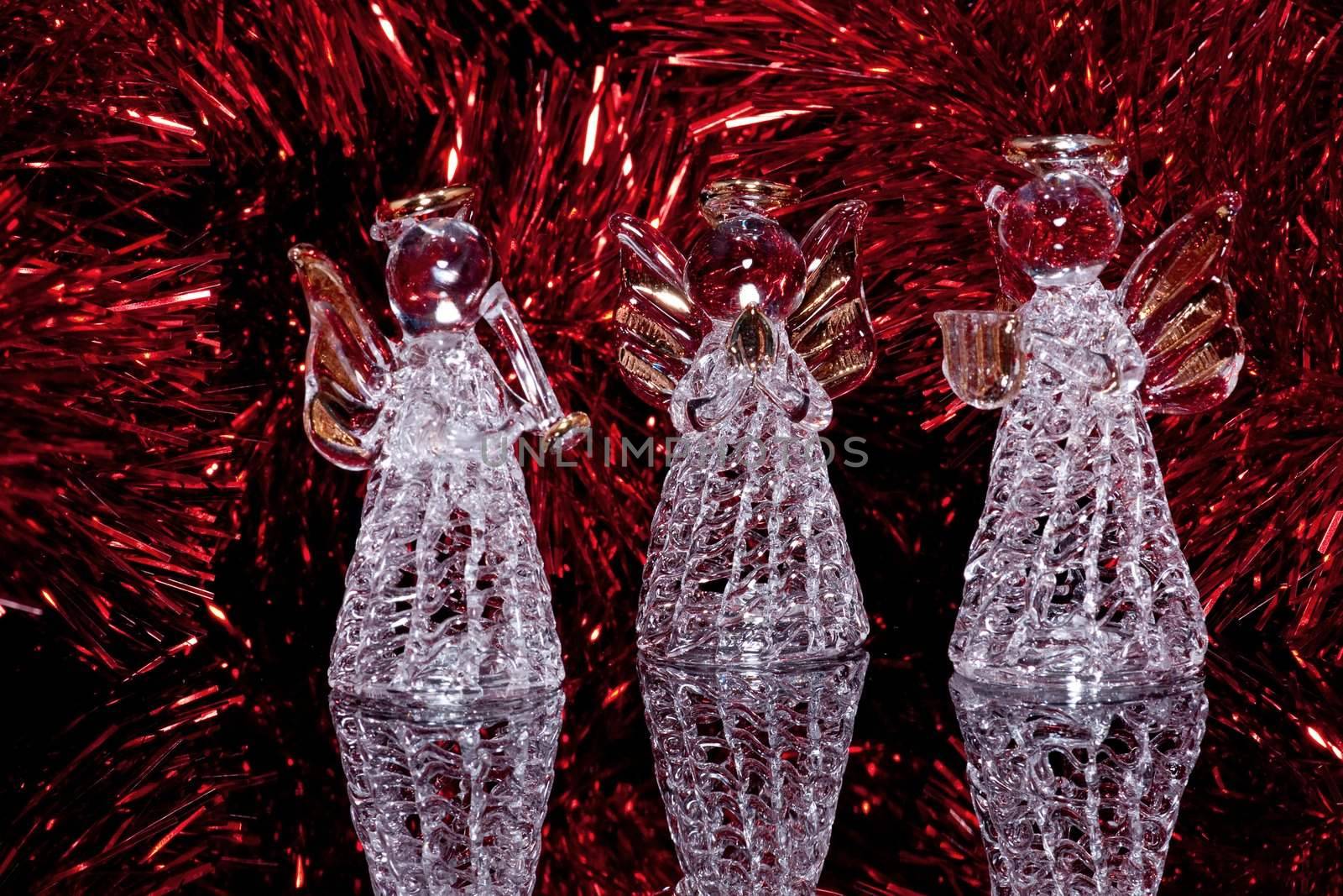 Three decorative glass angels on black by helgy