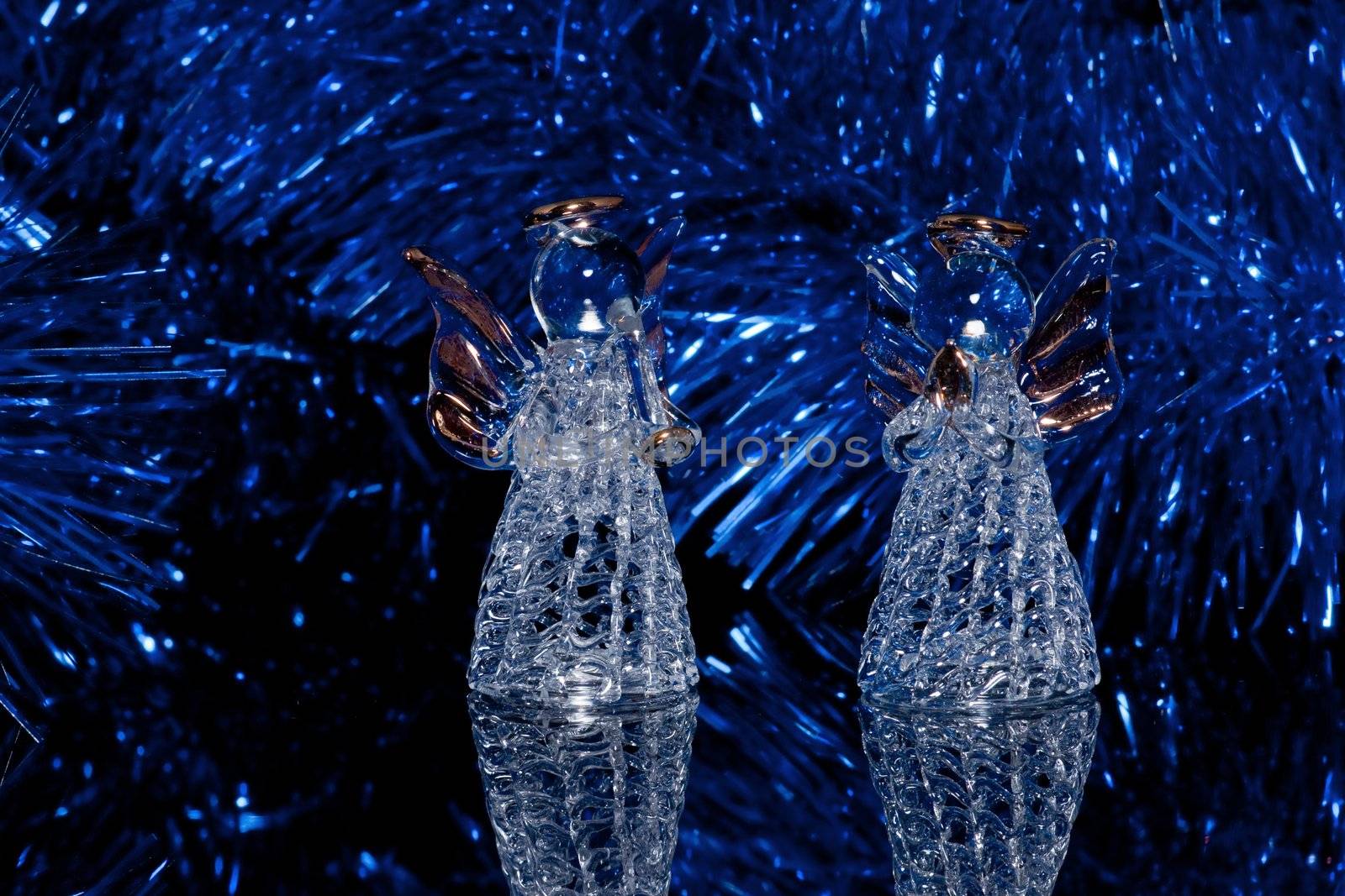 Two decorative glass angels on black by helgy