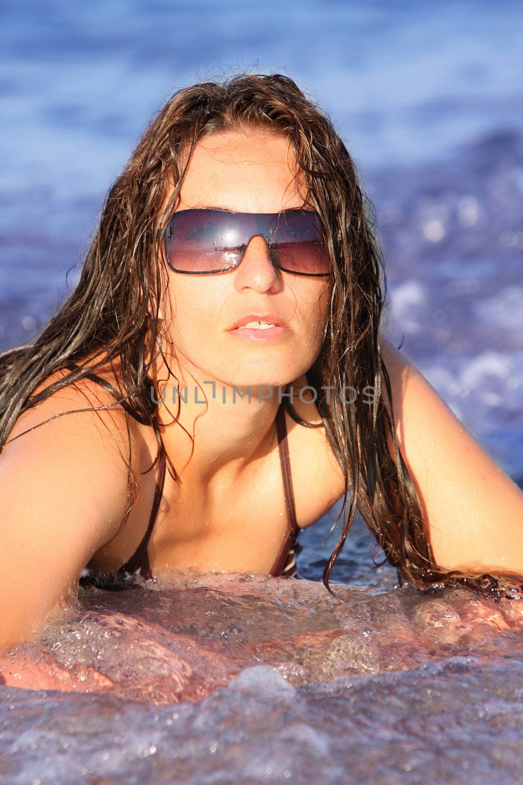 Young woman at beach in the sea