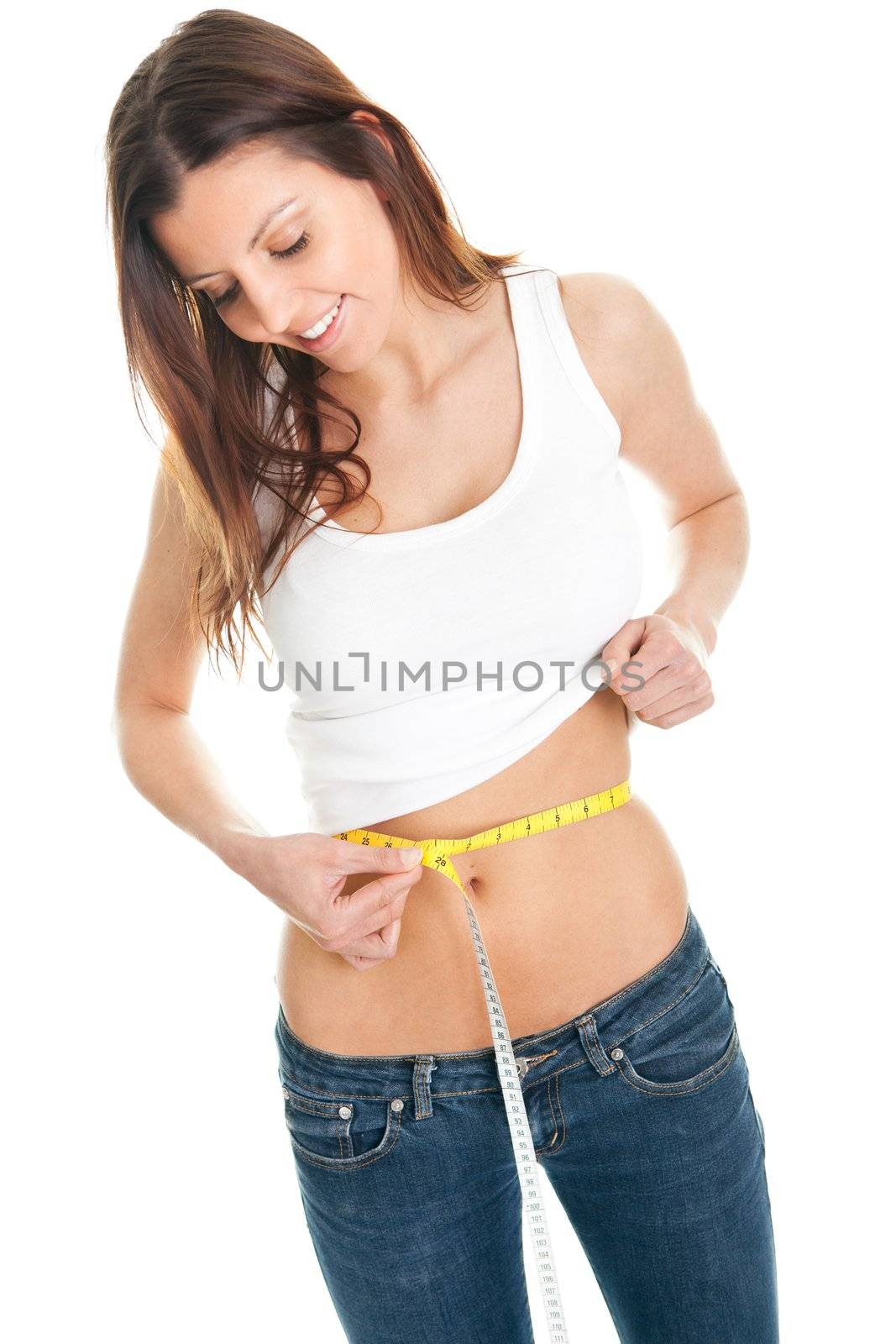 Beautiful woman measuring waist. Isolated on white