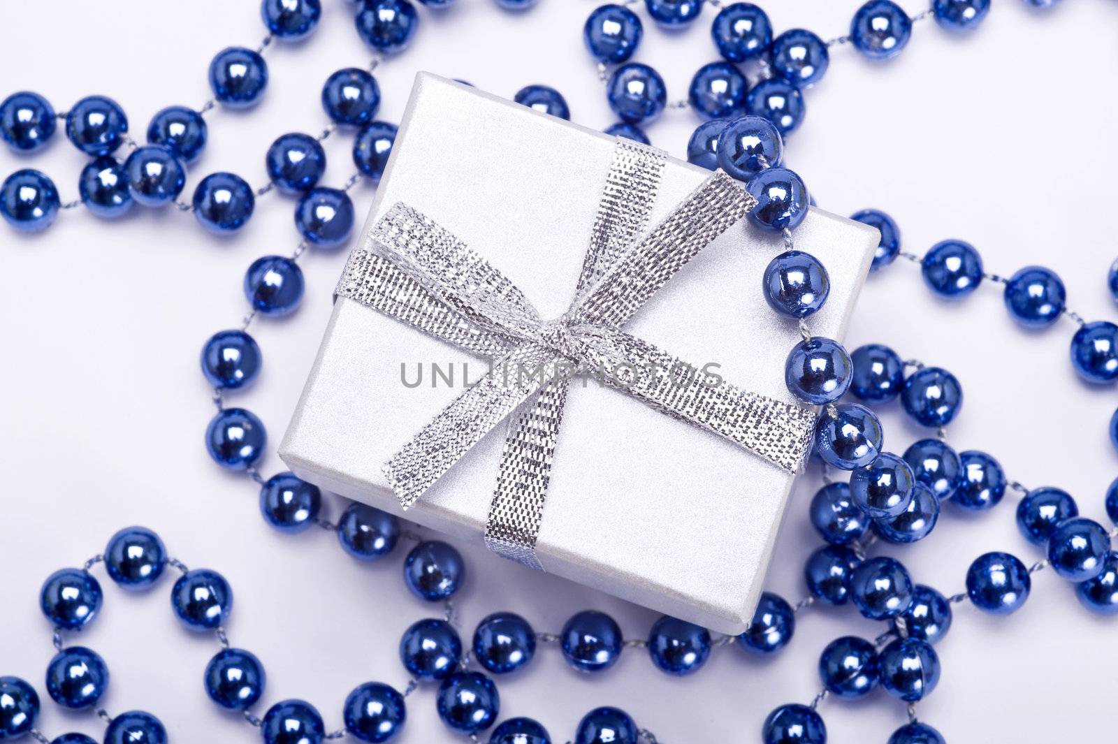 christmas silver gift with decoration on white background