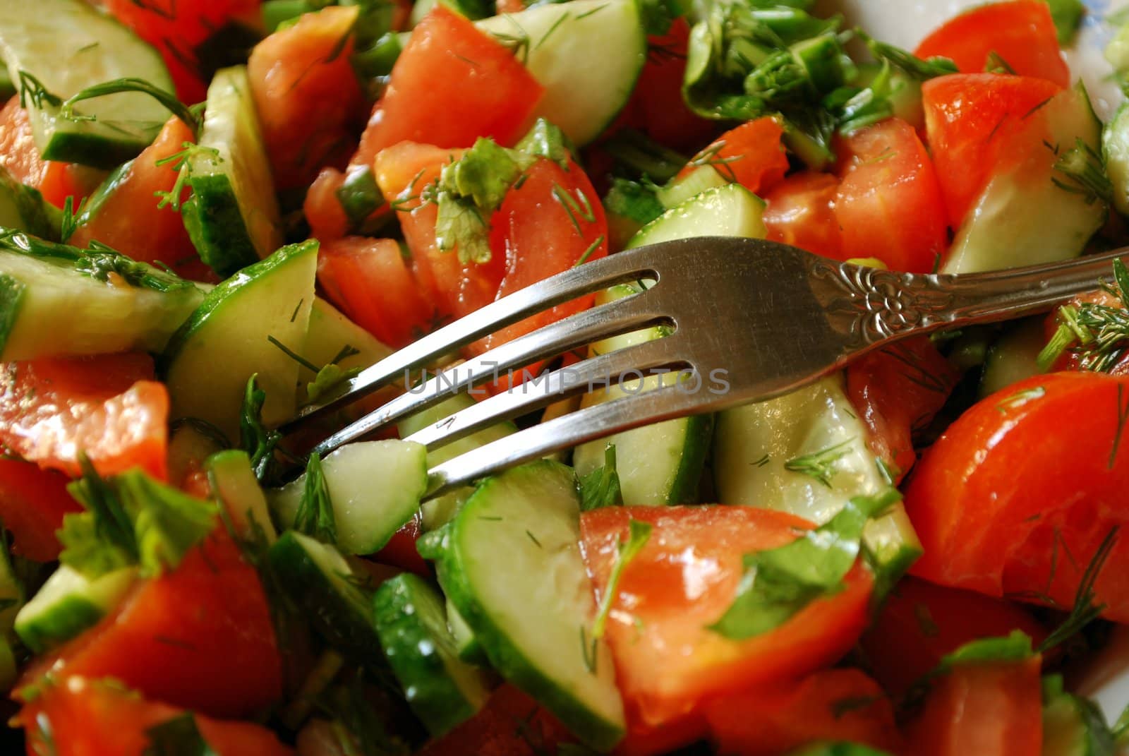 Tasty Salad of Tomatoes and Cucumbers with Fork