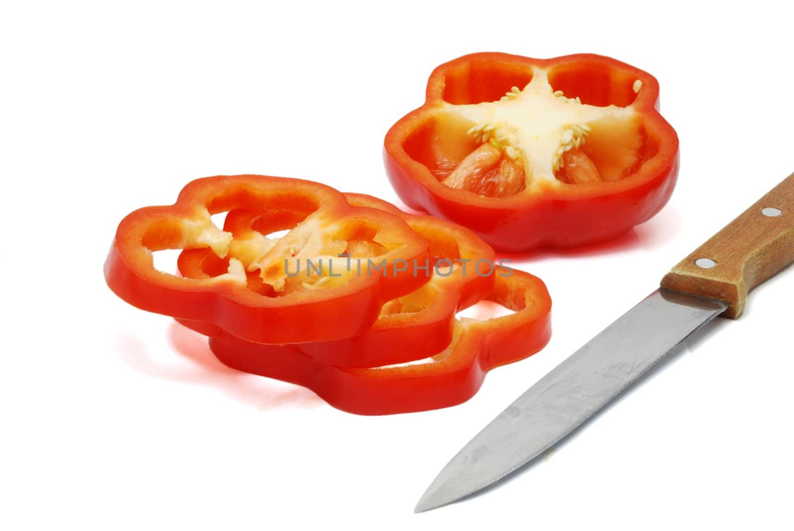 Isolated Sliced Red Pepper with Knife