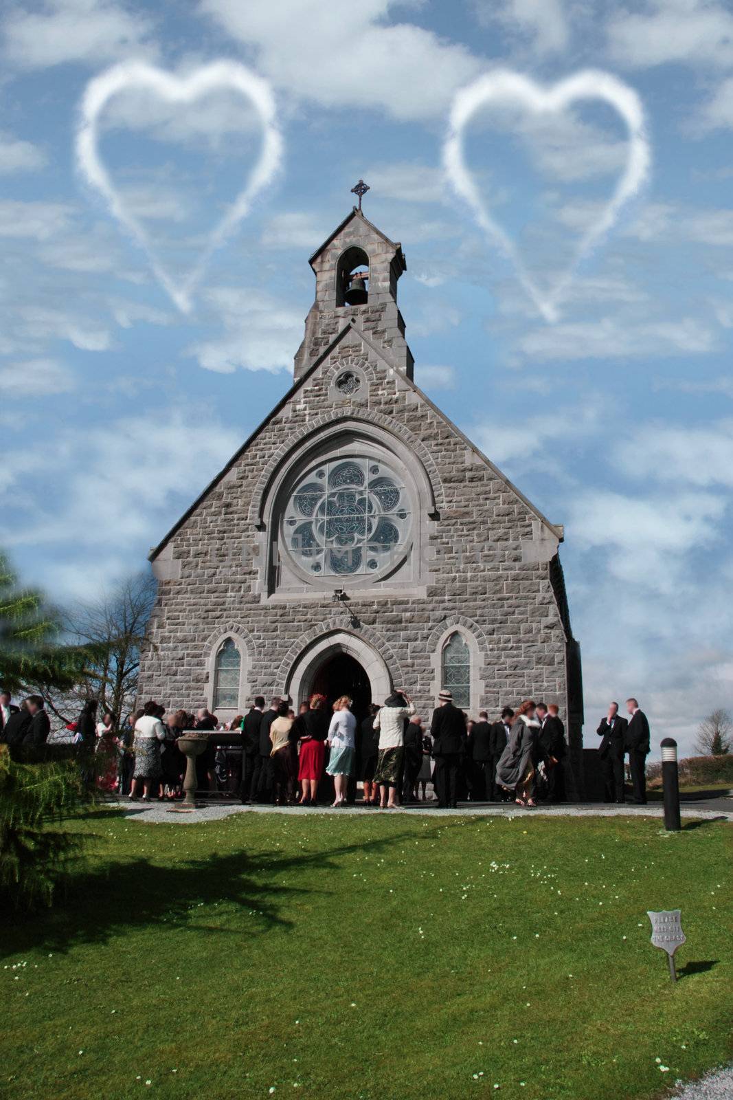 people outside a church celebrating the marriage of the couple