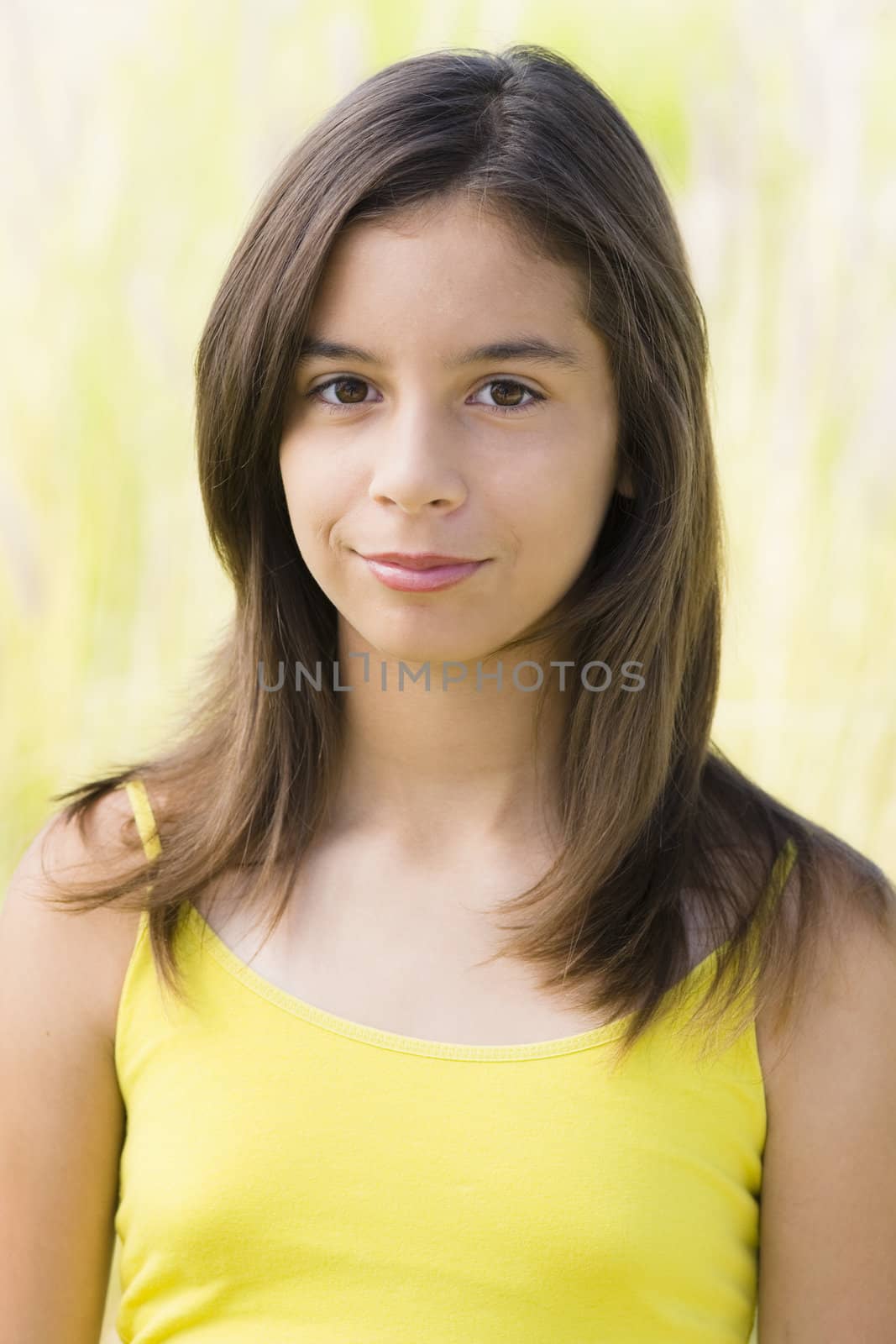 Hispanic Teenage Girl Smiling Directly To Camera