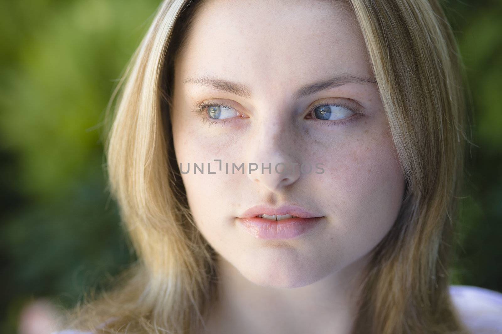 Closeup Portrait of a Smiling Pretty Blond Teen Girl