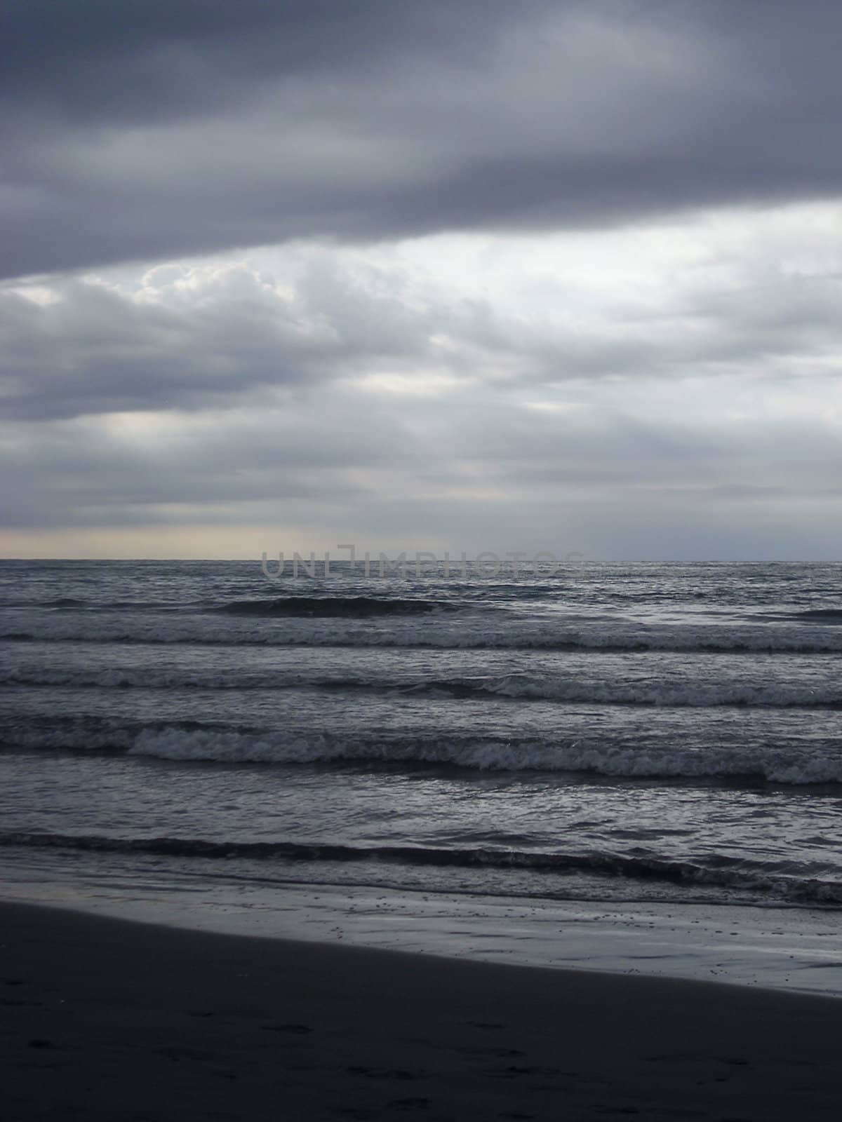 View of the beach of Benicassim, Spain, full of grey and blue tone lights.