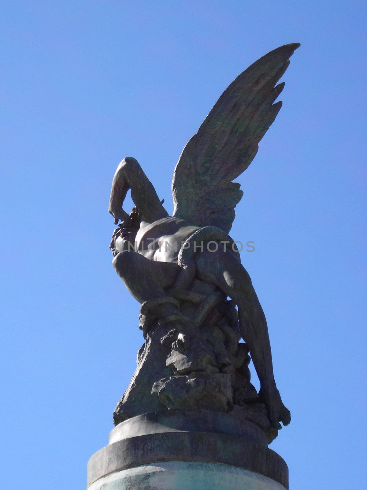 Bottom view of the only one statue in the world dedicated to the devil, located in the Retiro Gardens in Madrid.