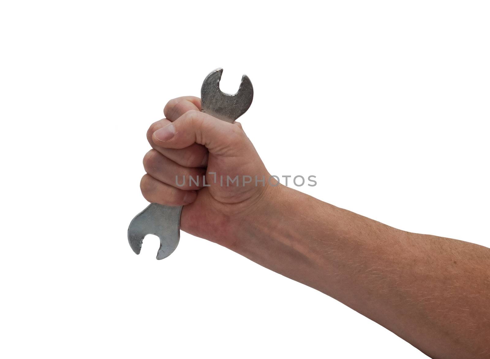 an isolated over white caucasian man's hand holding an open-ended old worn spanner.