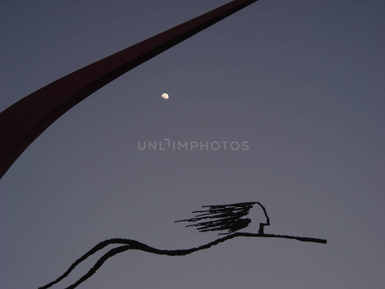         A sculpture in Madrid under the moon light.  