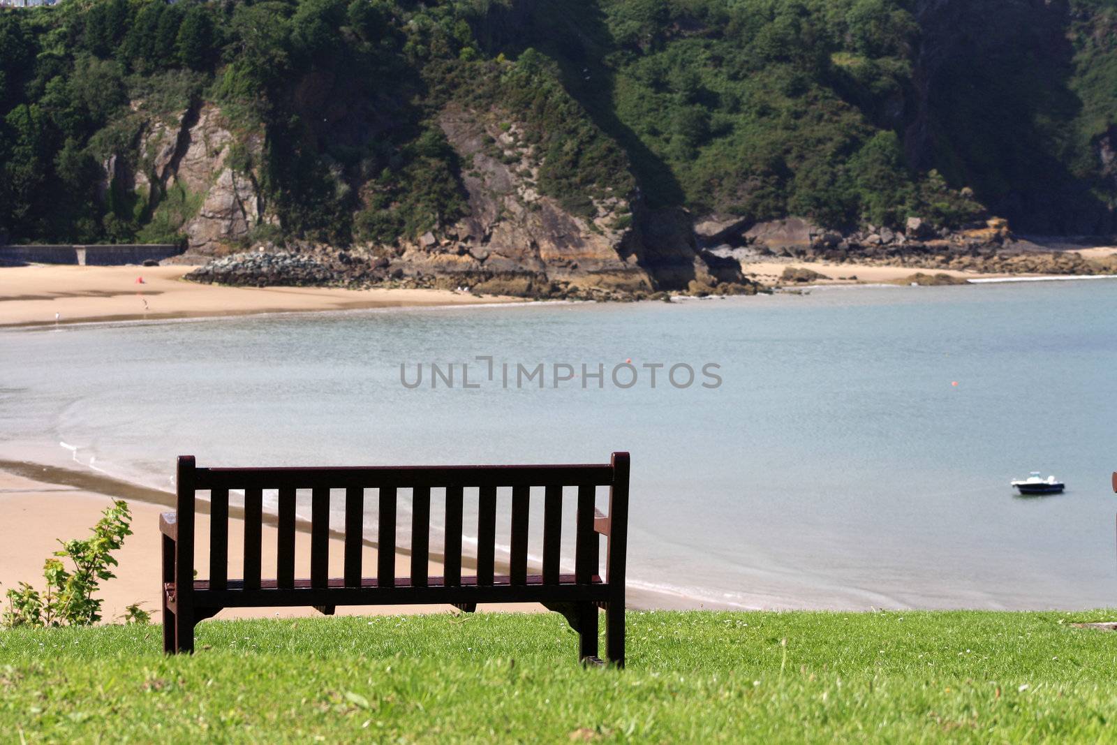 North Beach of Tenby, Wales, viewed from a bench on a hill.