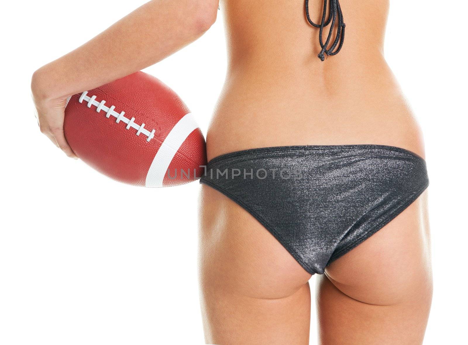 Beautilful woman posing with football ball by AndreyPopov