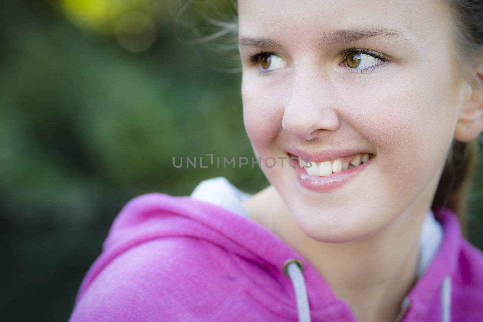Tween Girl Smiling Away From Camera
