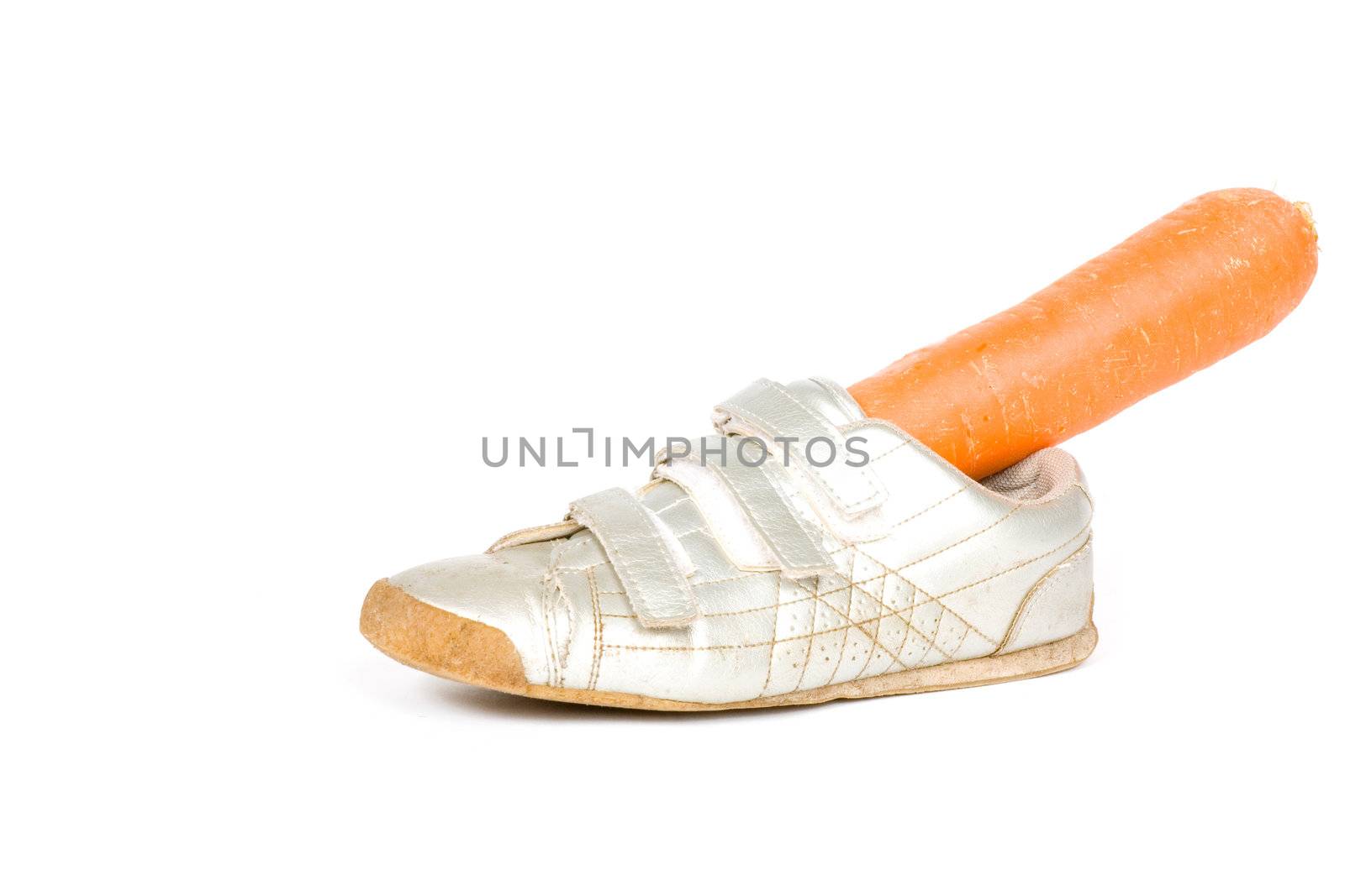 Shoe with carrot for the horse from Sinterklaas  on white

