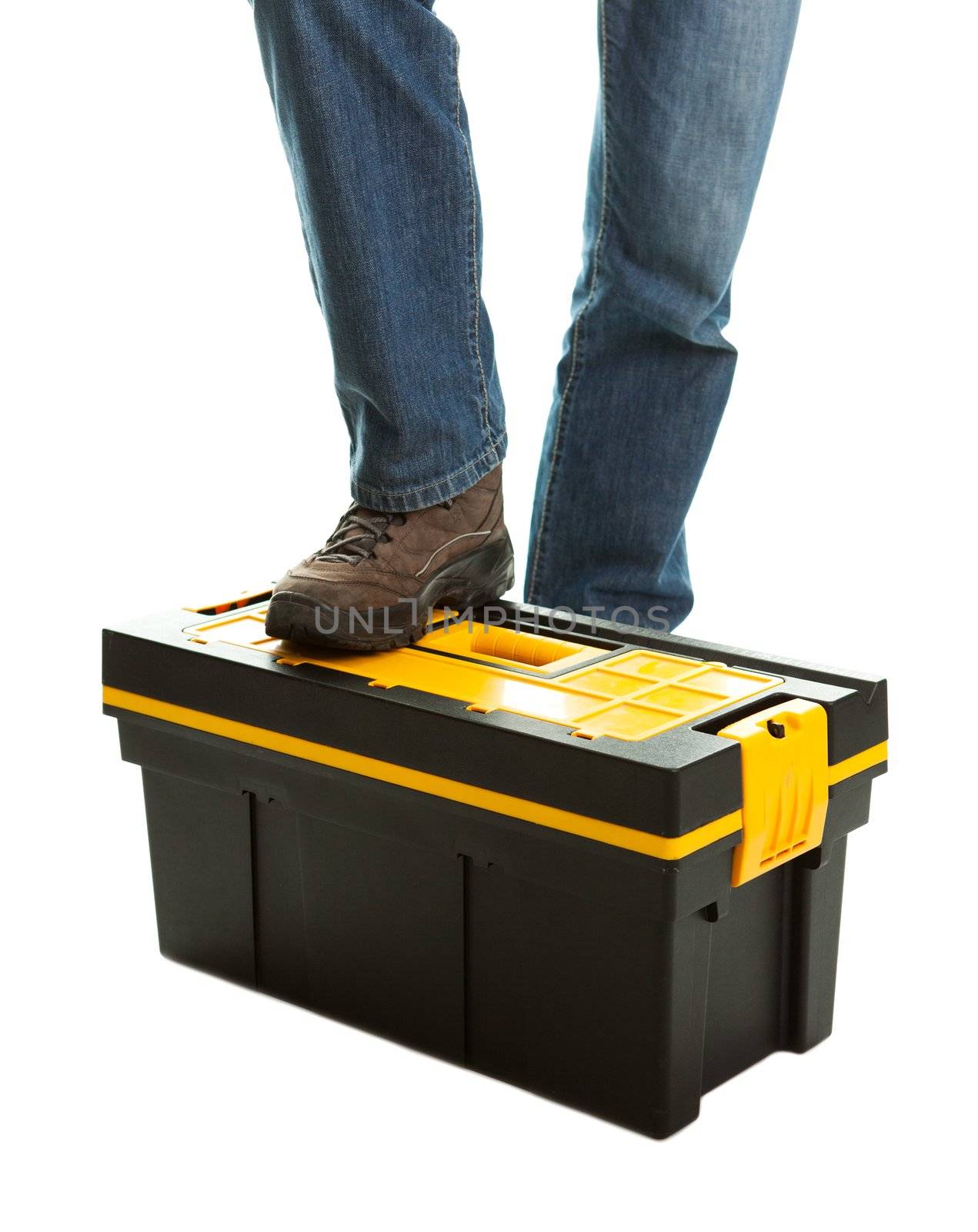 Close-up of repairman standing on toolbox. Isolated on white