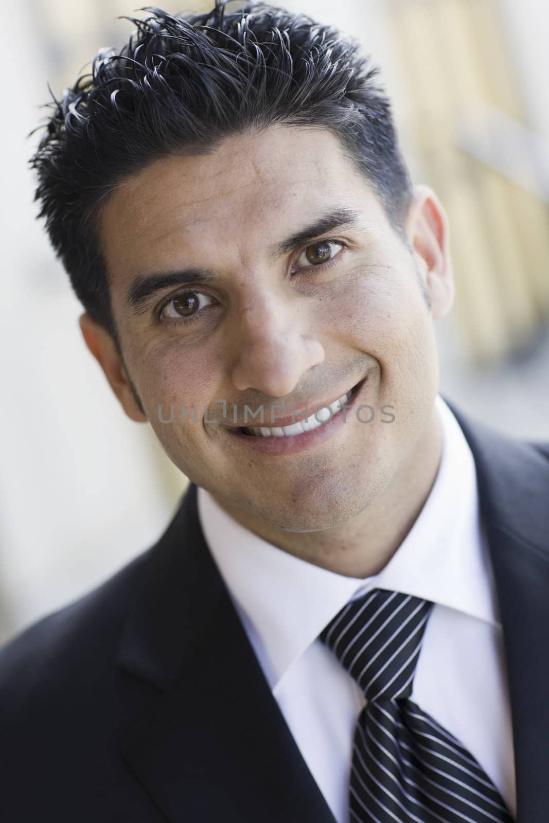 Portrait of Smiling Man Wearing a Black Suit and Tie