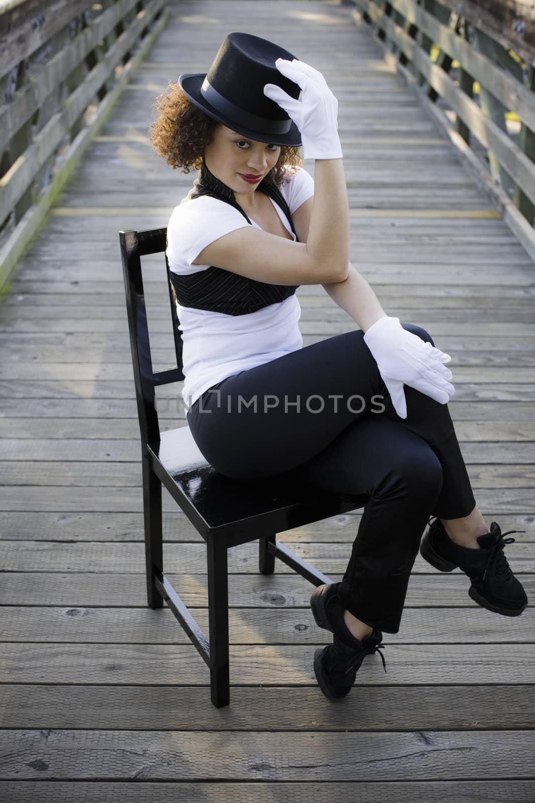 Jazz Dancer Sitting on Chair on Bridge