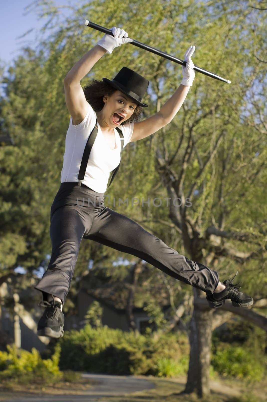 Female Jazz Dancer Jumping in the Air in Park