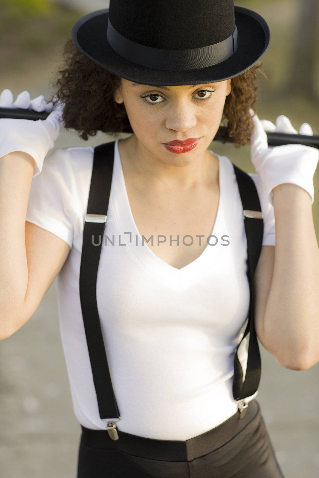 Portrait of Jazz Dancer with Cane and Tophat Outdoors