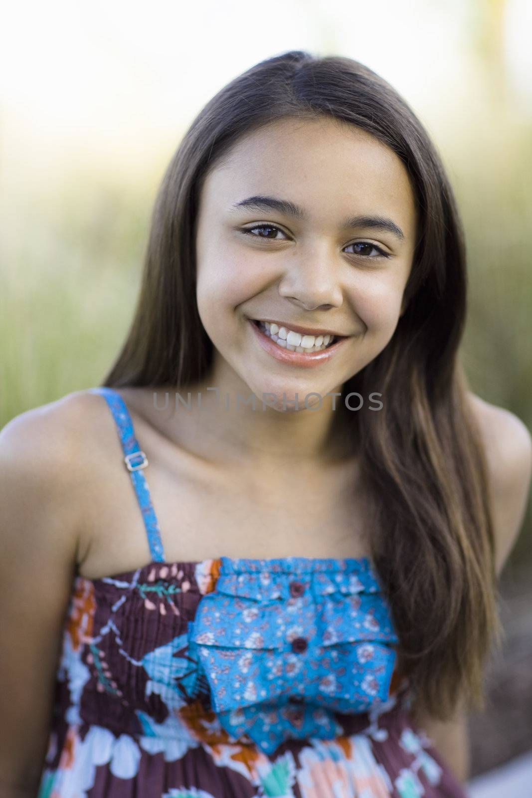 Tween Girl Smiling To Camera by ptimages