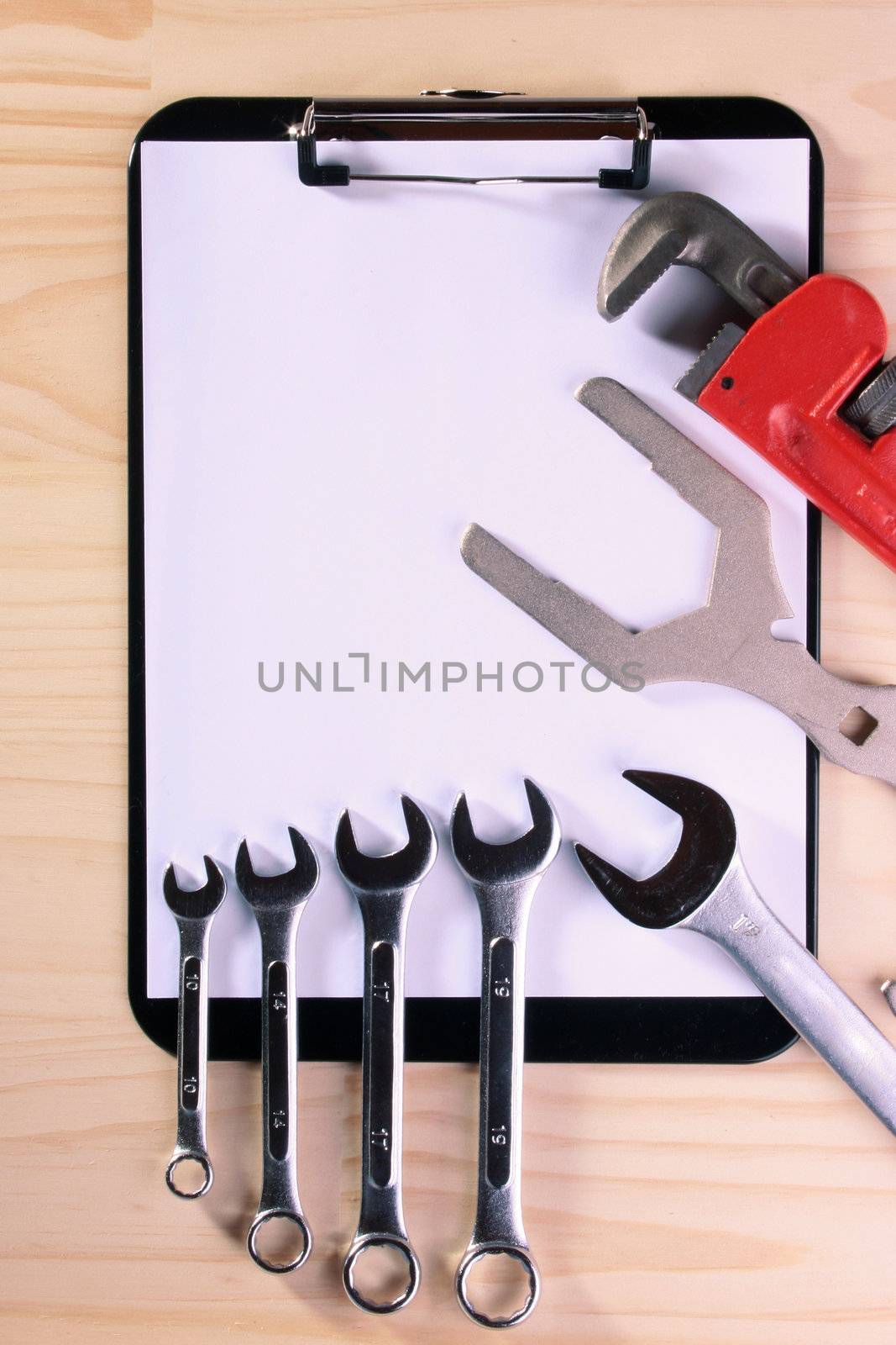 Set of wrenches on Blank Clipboard for the business connected with repair work.