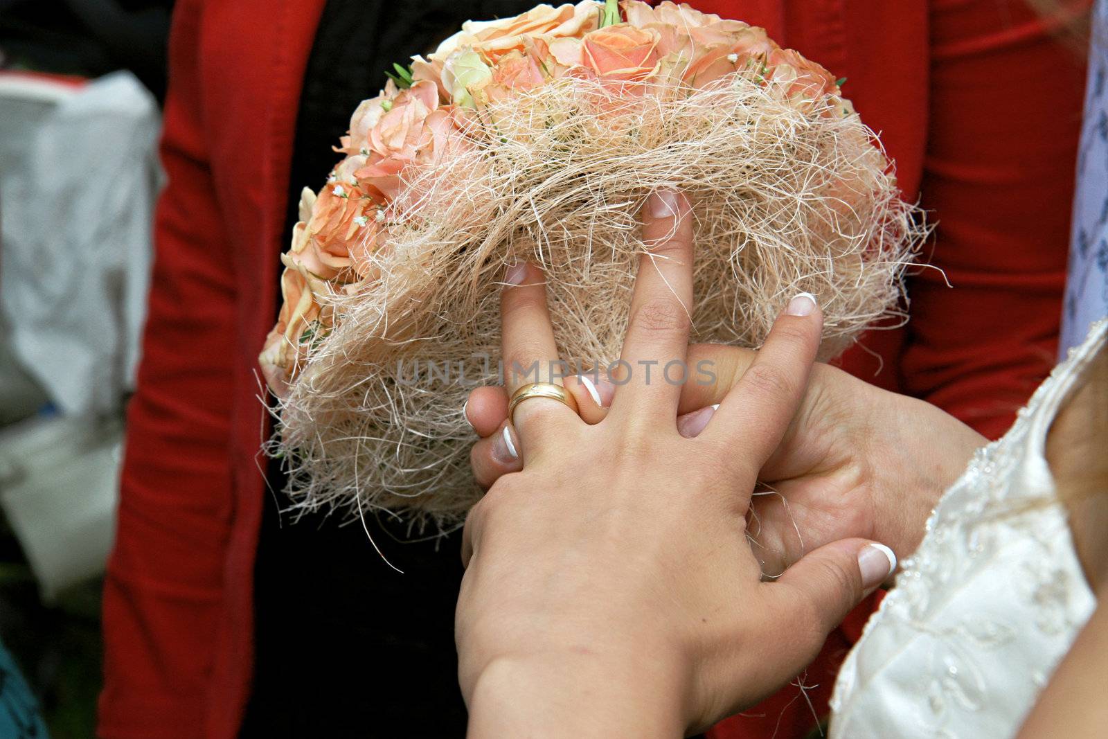 Ring on the finger of happy and excited bride.
