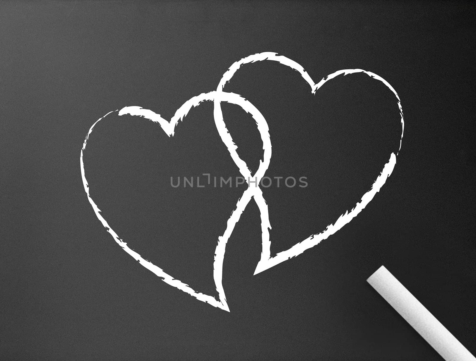 Dark chalkboard background with two hearts illustration. 
