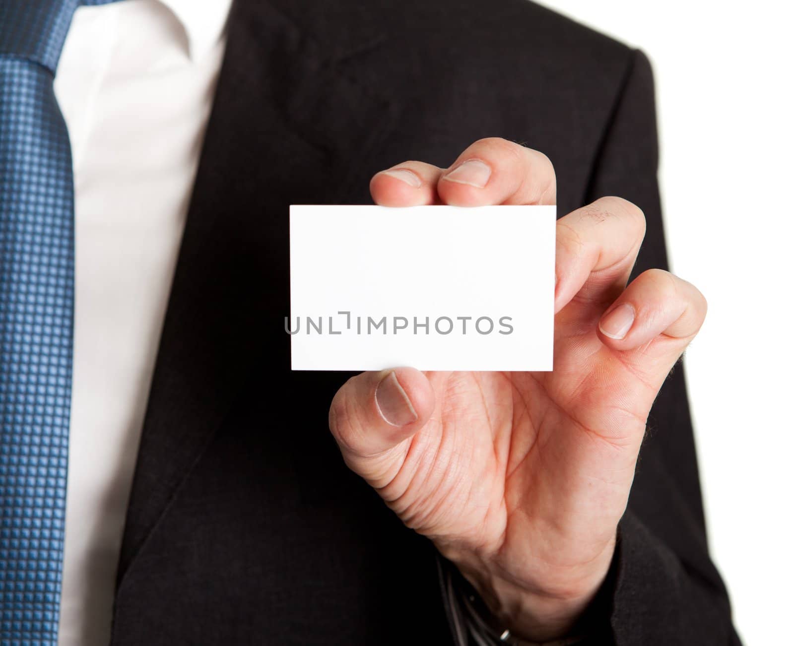 Close-up of businessman holding blank card. Isolated on white