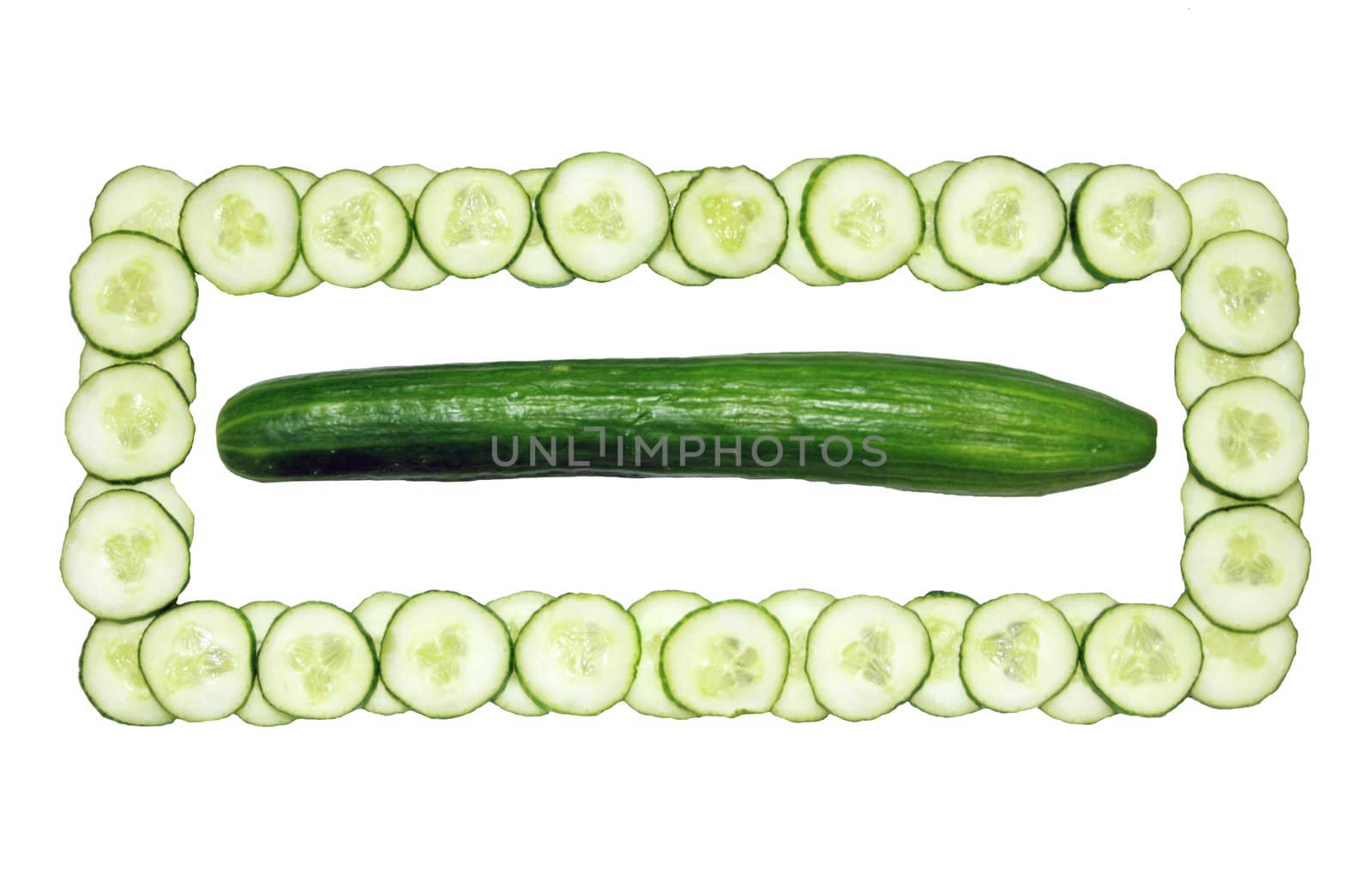 The green long fresh and cut cucumber in a square.
One whole cucumber, another cut for an ornament of a dish.