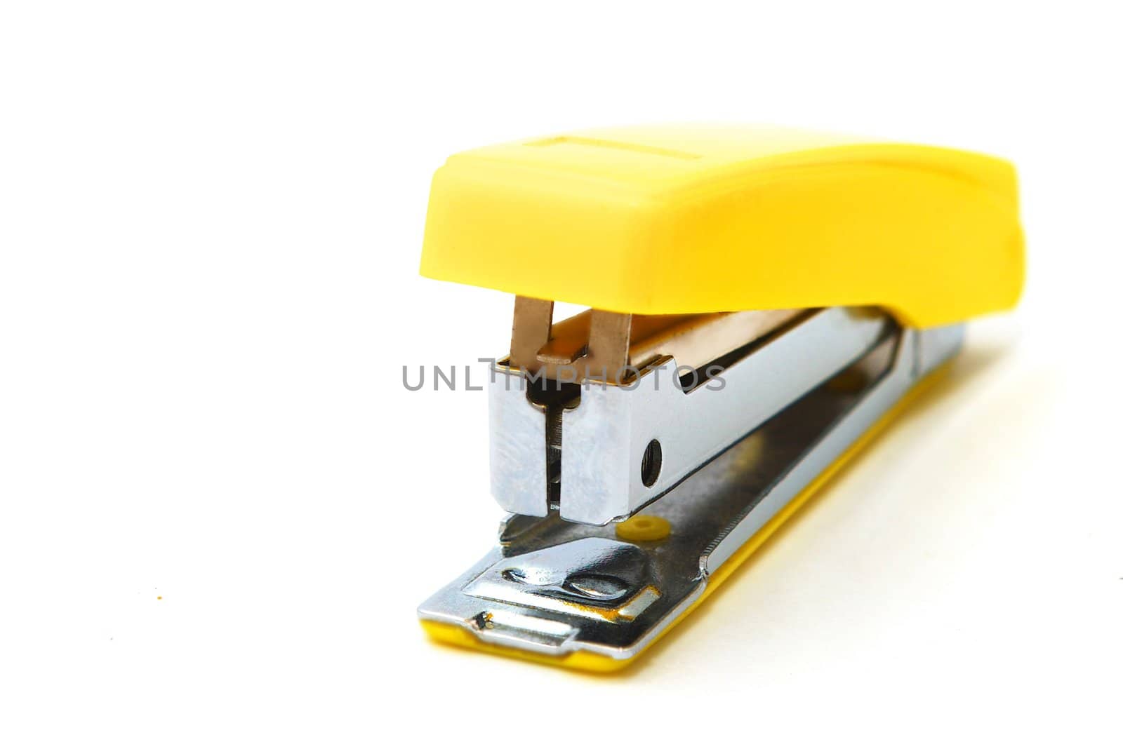photo of the yellow stapler on white background