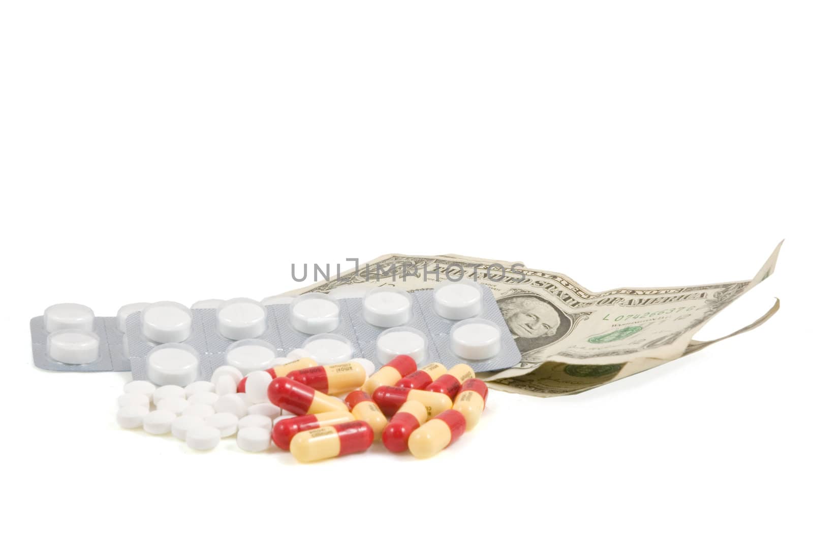 Pills with american dollar on a white background by ladyminnie