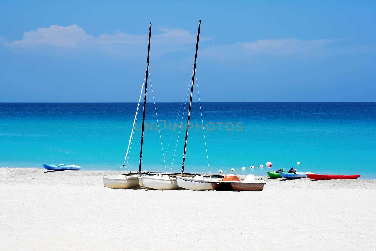 Katamarans and water bicycles in a beach