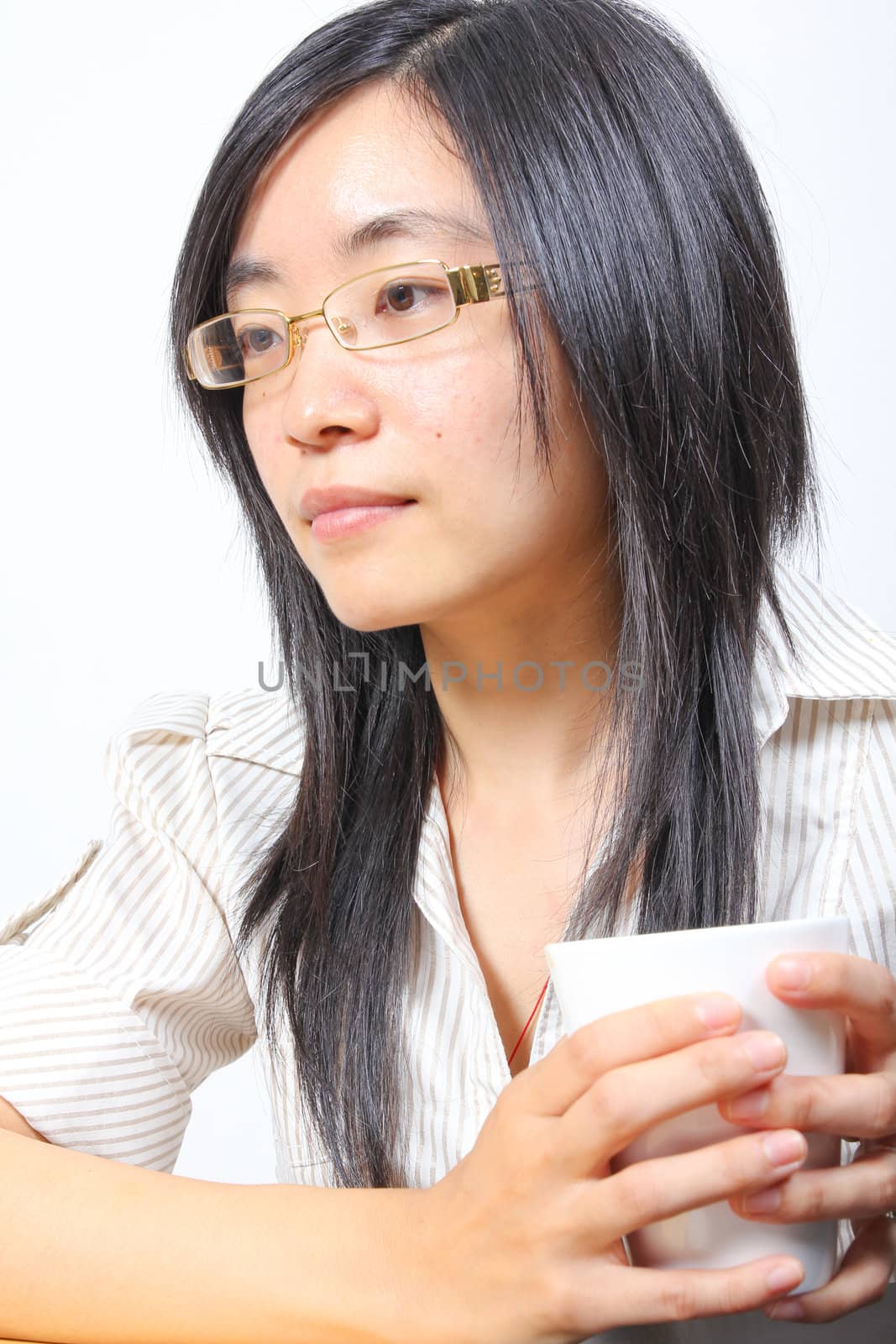 Chinese businesswoman drinking coffee