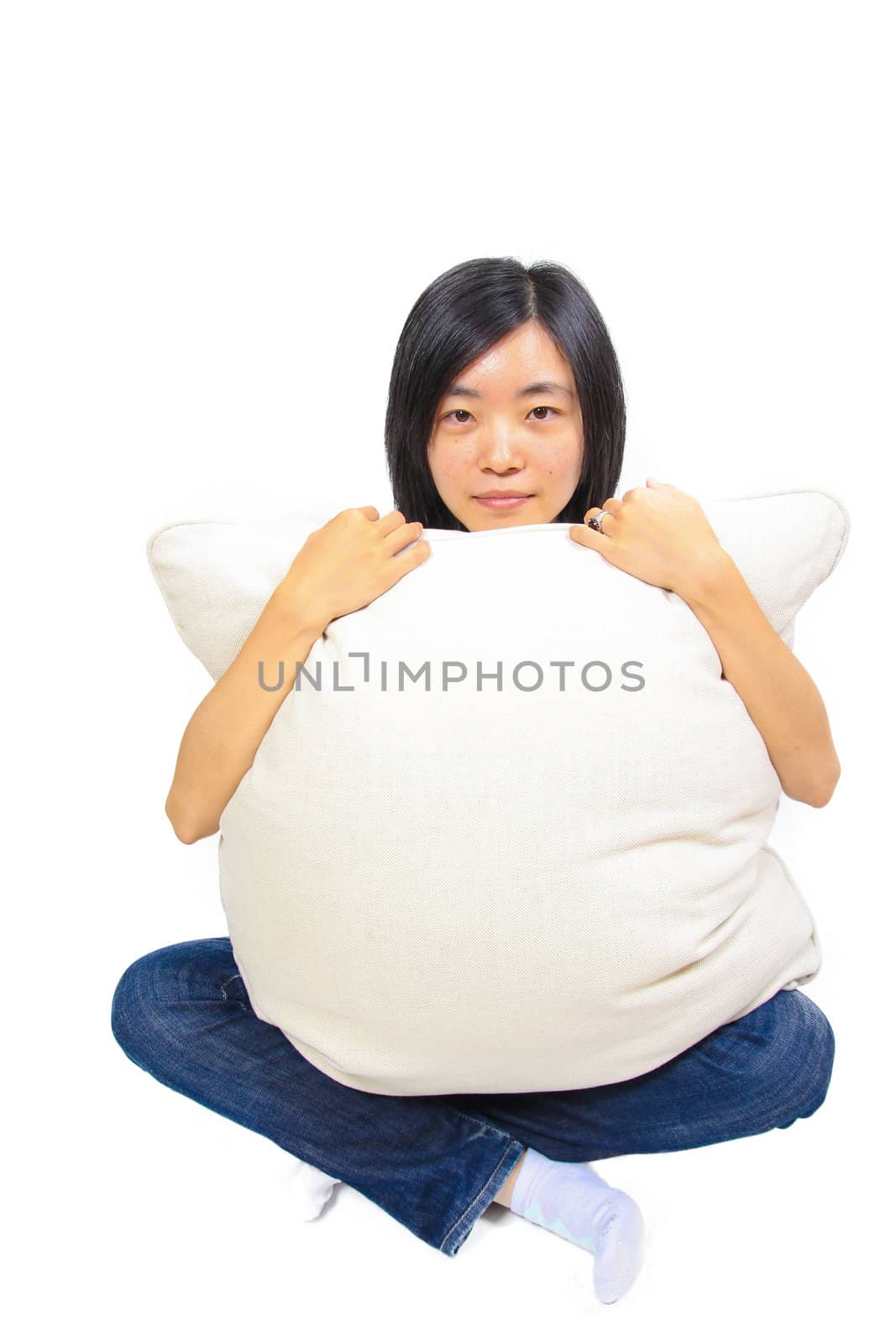 Young chinese woman hugging a pillow