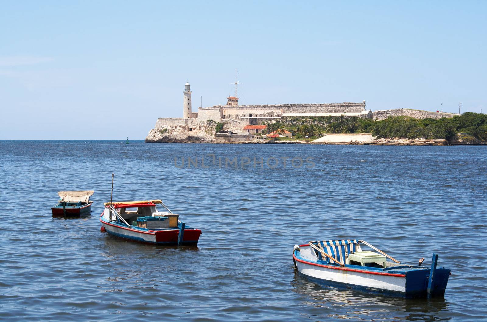 Fishing boats in the bay of Havana with El Morro in the background