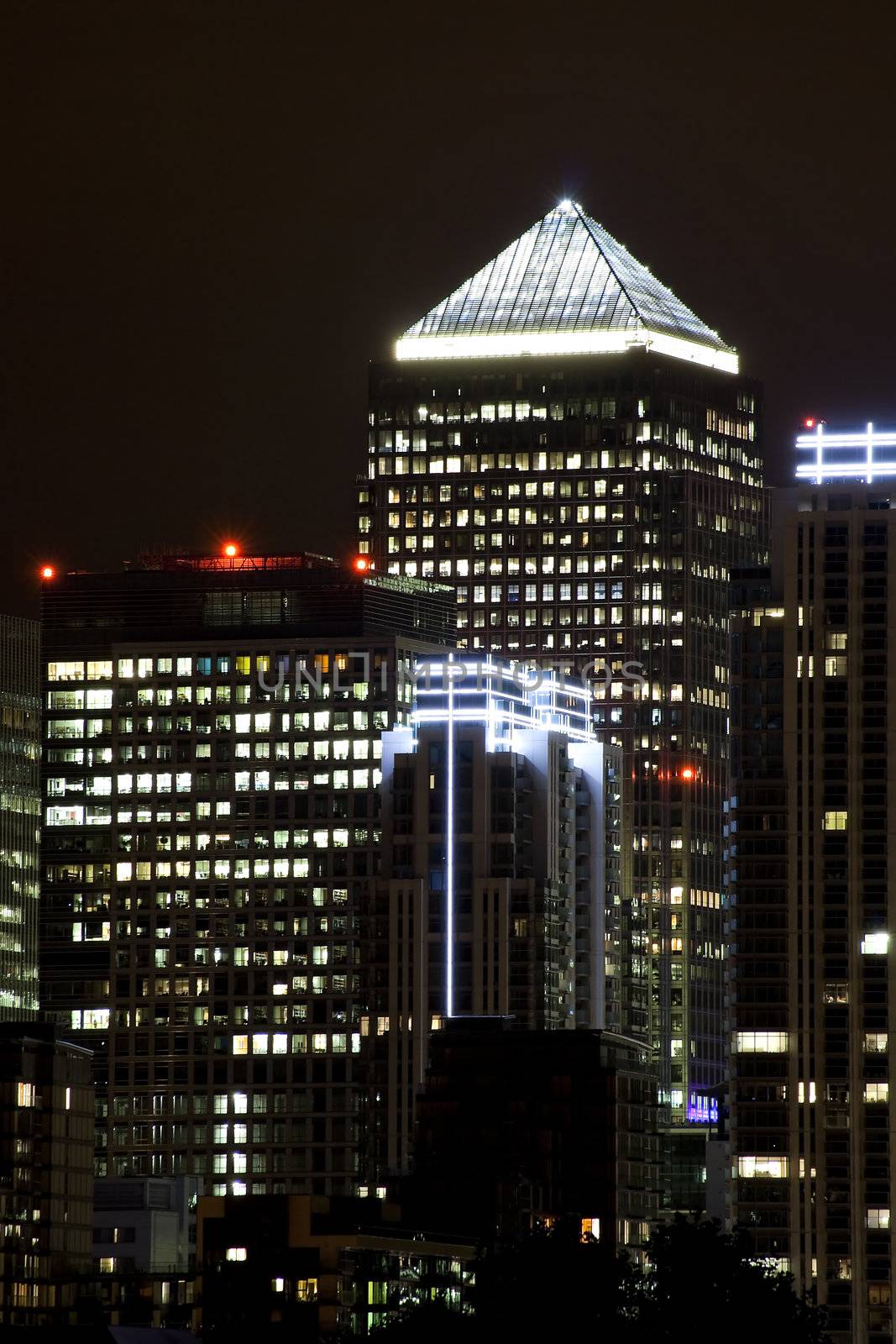 Canary Wharf skyscrapers in London illuminated at night