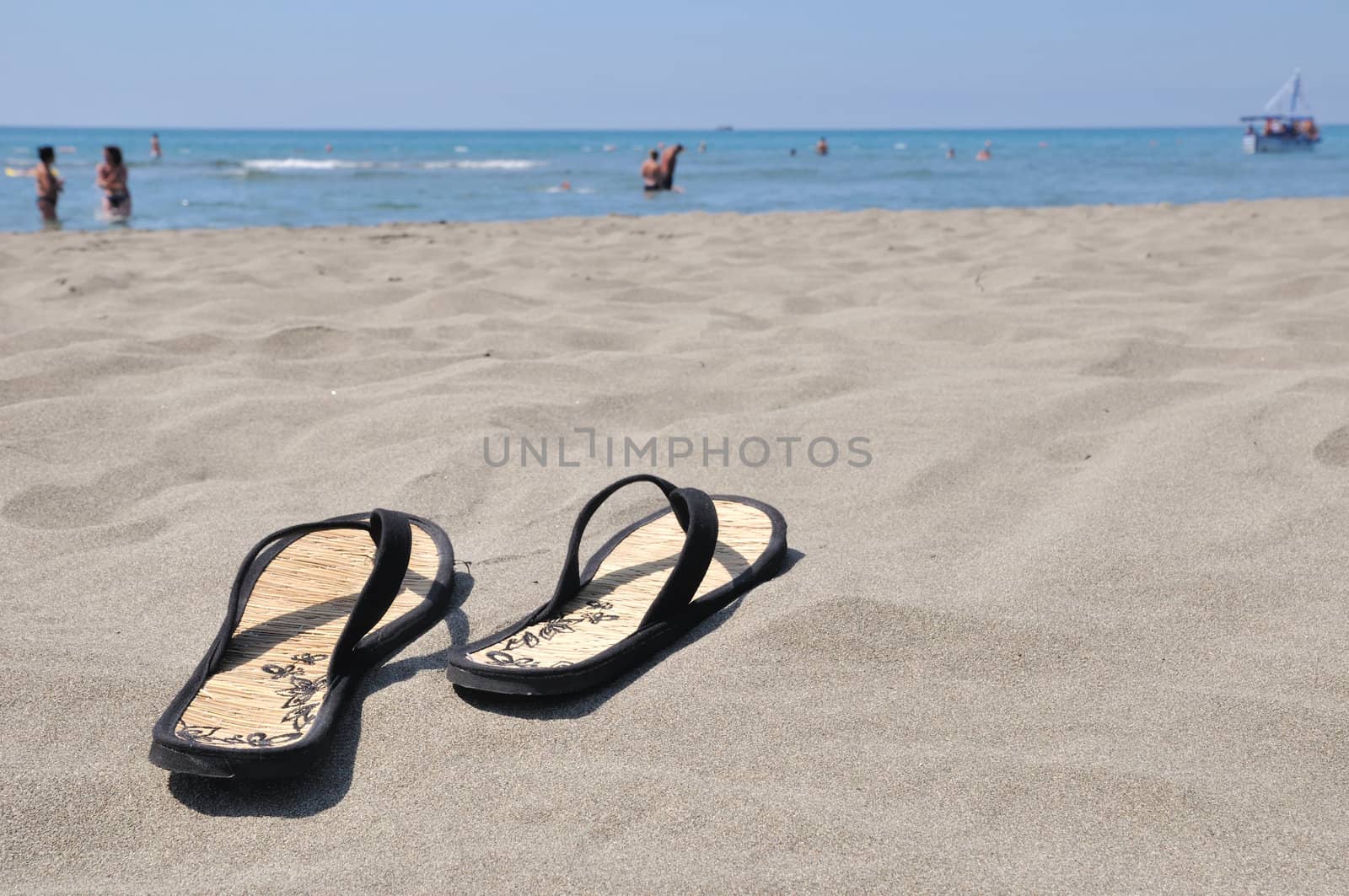 Slippers on beach by zagart36