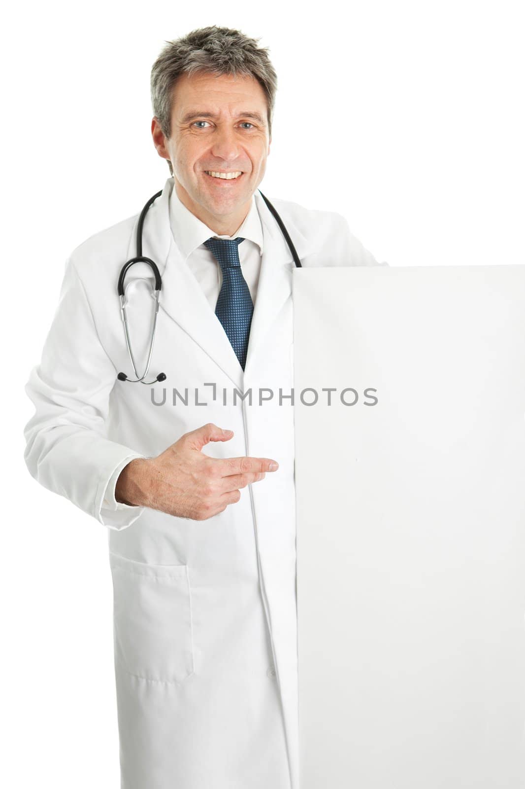 Smiling senior medical doctor presenting empty board. Isolated on white