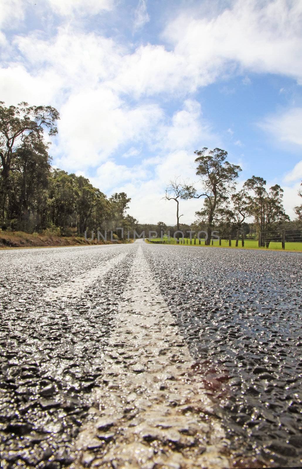 Straight Road Ahead With Dramatic Blue Skies